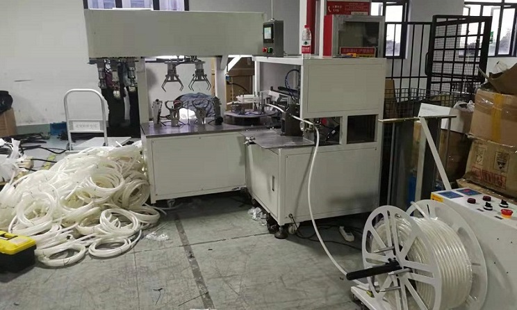 Automatic Tube Coiling and Strapping Machine